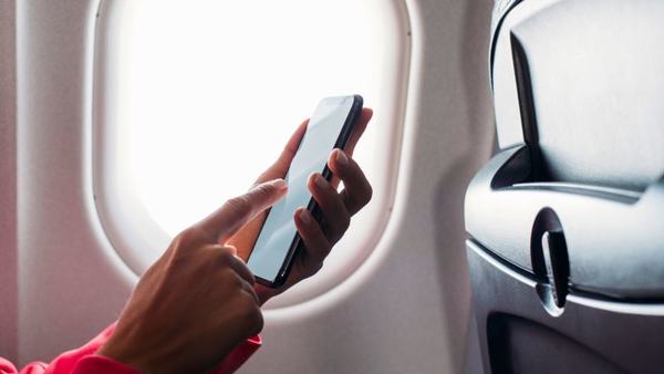 heres-the-real-reason-to-turn-on-airplane-mode-when-you-fly-scrape-1767538608.jpg